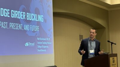 Dr. Matthew Reichenbach presents his research on the lateral-torsional buckling behavior of non-prismatic steel bridge girders at a Steel Bridge Task Force meeting in Lafayette, Indiana.