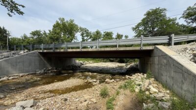 The Hendrix Road Bridge is a 45-ft span with a 24-ft roadway, supported by four W21×101 weathering steel girders.